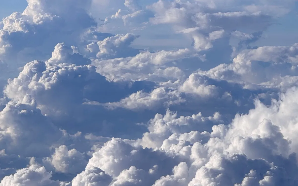 Sun and cloud over open water
