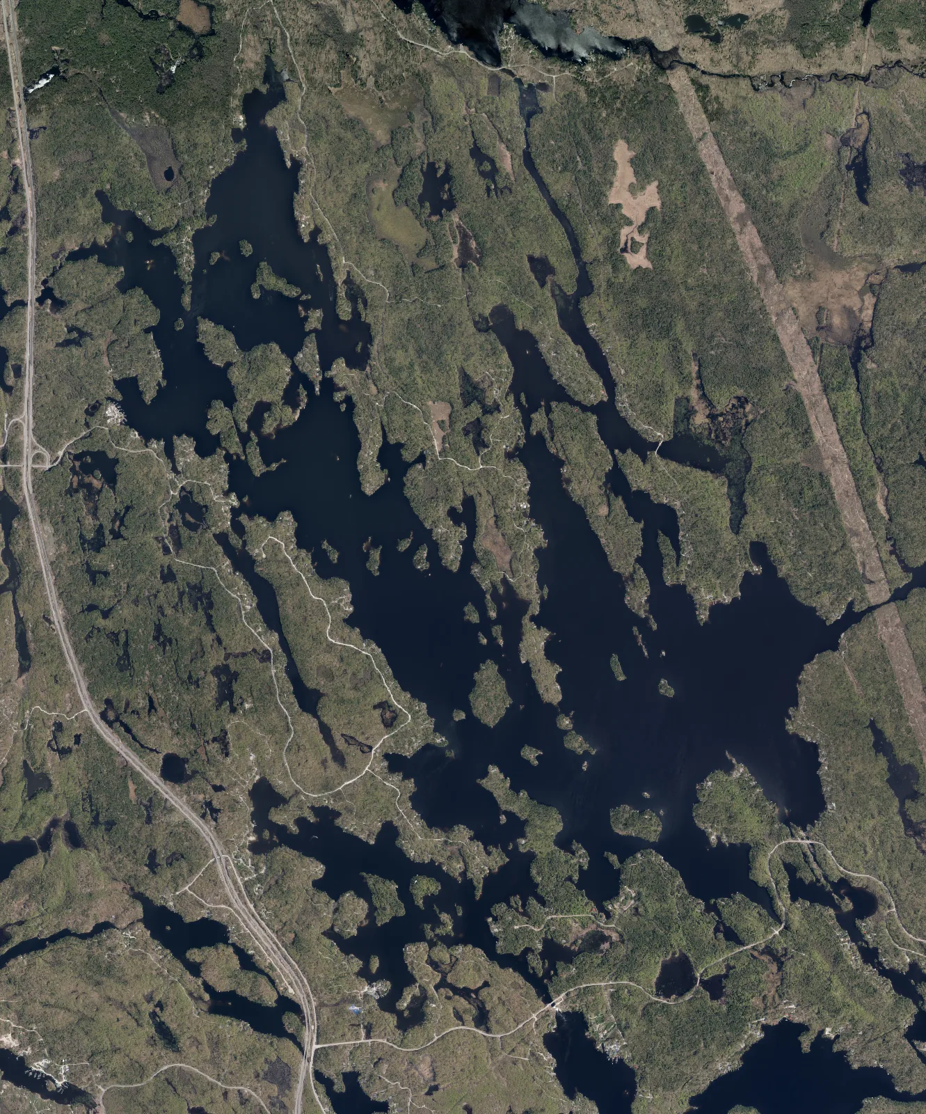 Aerial photograph of Six Mile Lake.